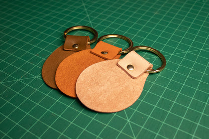 The backside of a set of round keychains.