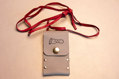 Gray leather riveted thumb drive necklace.